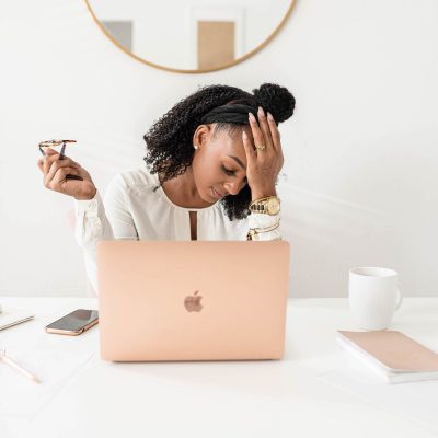 Woman Frustrated face palming in front of computer screen | where to start with cyber security & cyber safety strategies